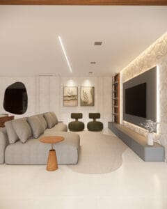 Sala de estar com parede revestida em pedra natural branca com iluminação LED, sofá cinza amplo e tapete orgânico.